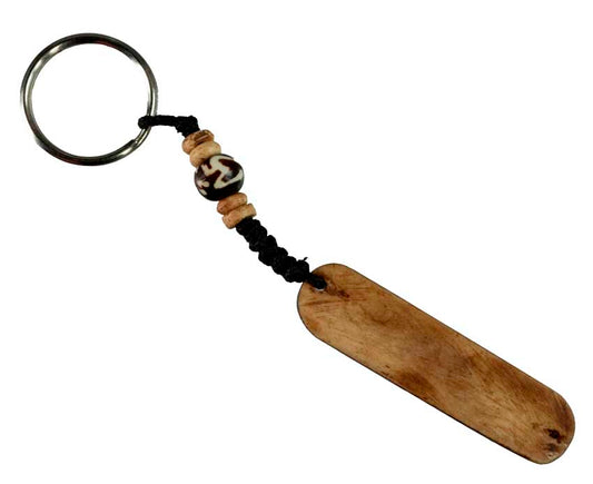 Porte-Clés Om Artisanal en Os de Bovin – Artisanat Traditionnel du Népal