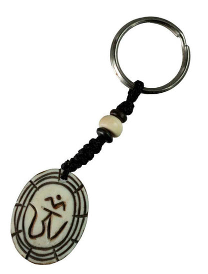 Porte-Clés Om Tibétain Blanc Artisanal en Os de Bovin – Artisanat du Népal