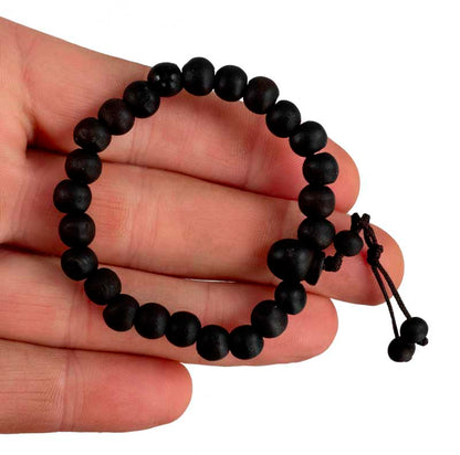 Bracelet tibétain perles de bois teintées noires – Bijou artisanal du Népal