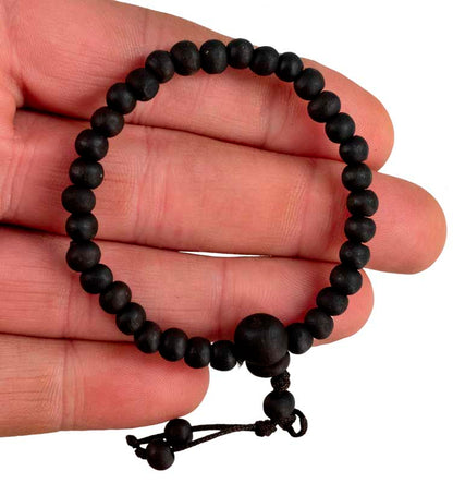 Bracelet tibétain perles de bois teintées noires – Bijou artisanal spirituel du Népal