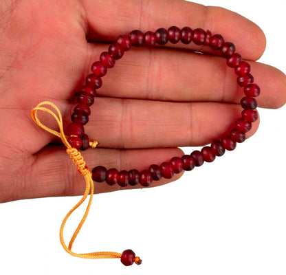 Bracelet tibétain perles bordeaux en corne teintée – Bijou artisanal népalais