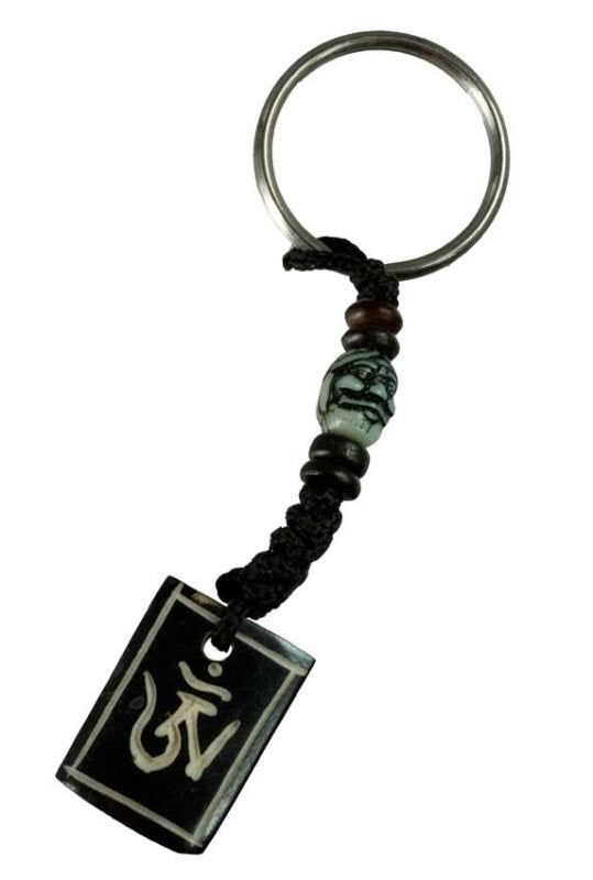 Porte-Clés Om Tibétain en Os de Bovin – Artisanat Traditionnel du Népal