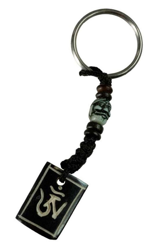 Porte-Clés Om Tibétain en Os de Bovin – Artisanat Traditionnel du Népal